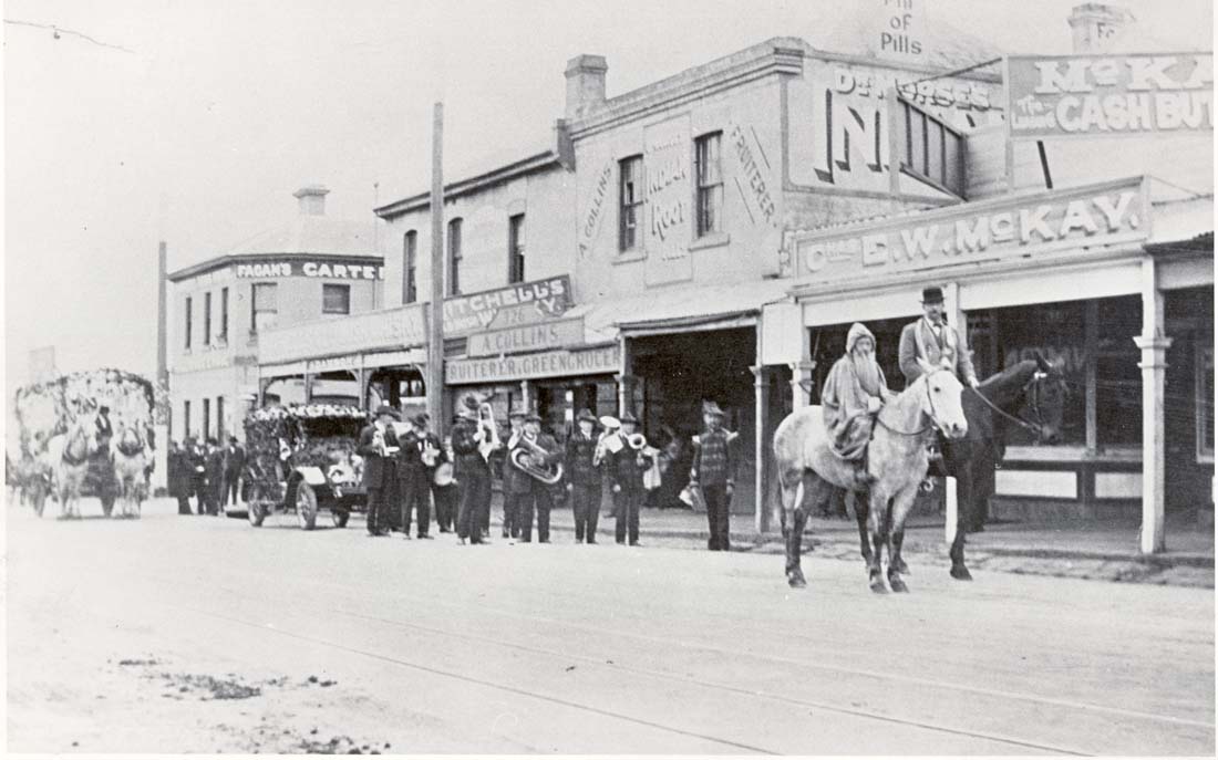 Image of A Labour Day Procession in High Street Northcote. The Carters Arms Hotel is behind the float to the left [LHRN467]