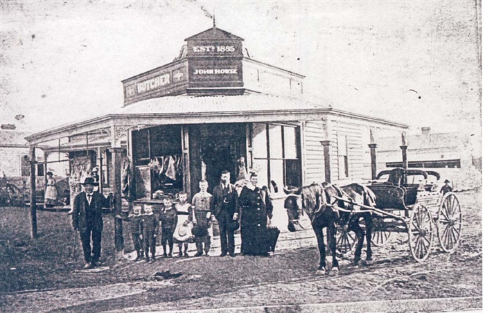 Image of Horse and cart outside Howse's butcher shop