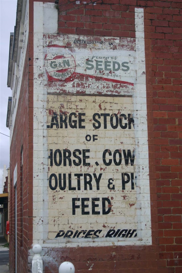 Image of the Original sign on side of building. [LHRN1658-4]