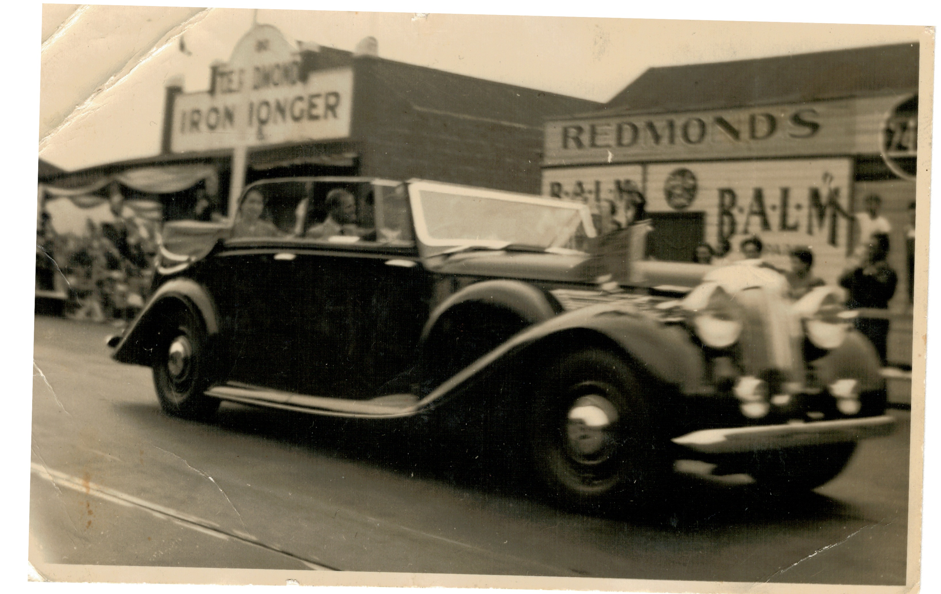Image of Redmond's Ironmonger on High Street, near Dennis Street, with Queen Elizabeth and Prince Philip on their first visit in 1954