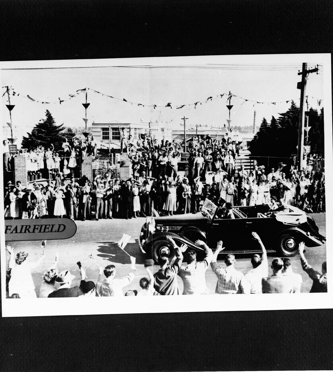 Image of parade outside the Paper Mills for Queens visit 1954