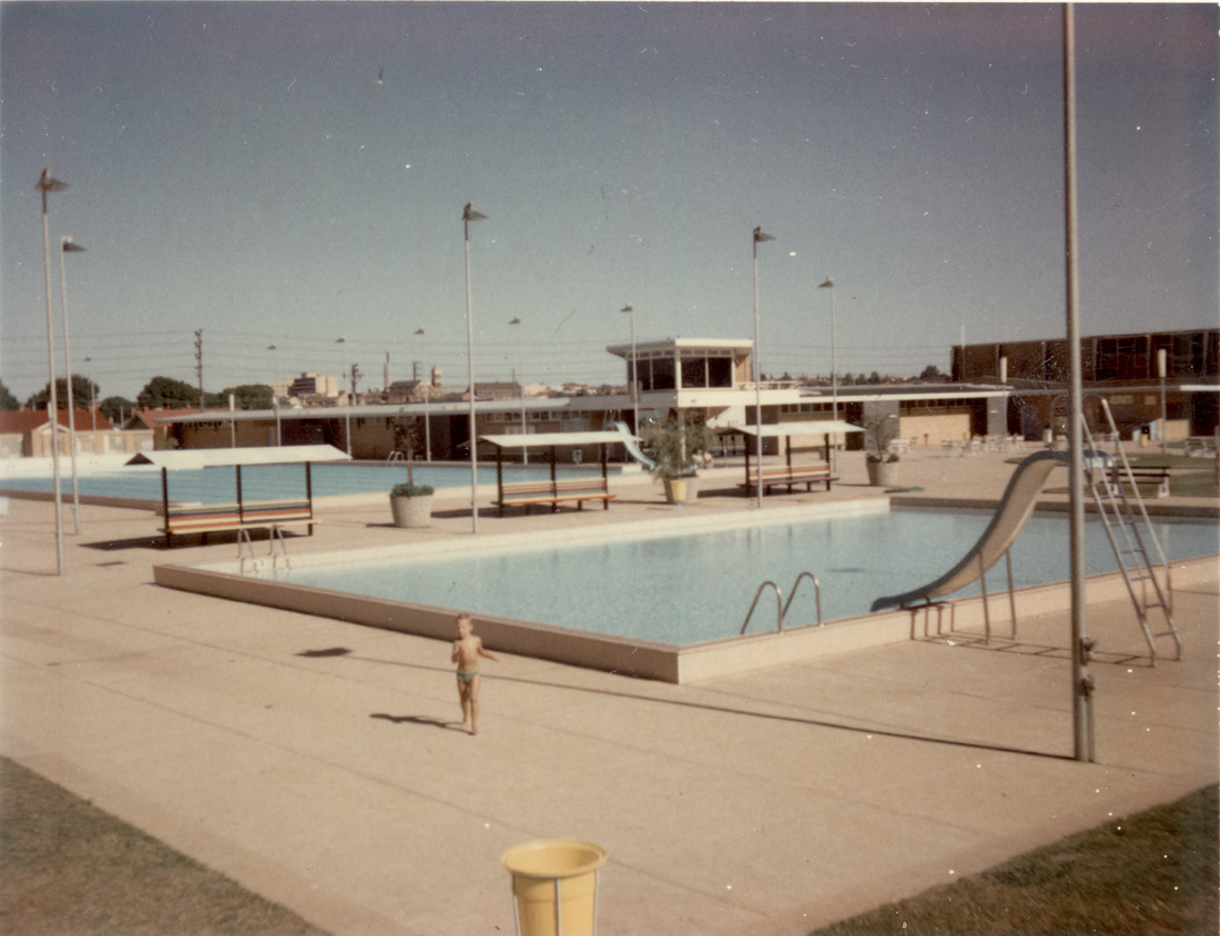 Photograph taken of Preston Olympic Pool, St Georges Road, Preston in the late 1960s. Paul, son of Peter Cairns the Pool Manager is in the foreground. [LHRN2292]