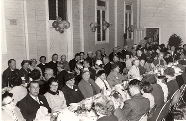 Image of people celebrating 100th Anniversary dinner of All Saints Church Northcote