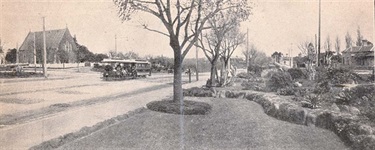 View down High Street, Northcote in the 1920's. All Saints Church is visible on left. [LHRN1733]