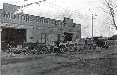 Image of Assorted vehicles outside garage in Preston c1930s [LHRN1797]