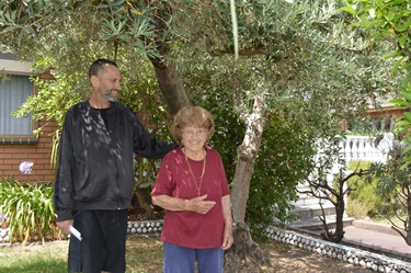 Albert and Vincenza standing in front of the Olivetree