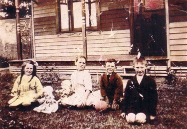 Effie, Edna, Bert and Charles Webber, children of Daphne May Corneille and Charles Henry Webber. Photo taken at their residence in Reservoir, Melbourne Victoria 1926 - [LHRN5437-3]