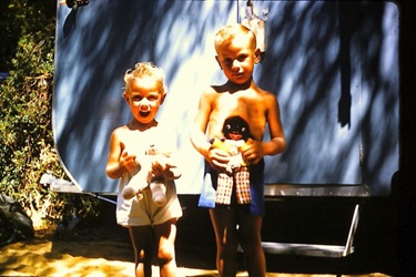 Lynette and Brian Latham, children of Valarie Latham, outside the family caravan at 4 Storey Road, Reservoir, 1959 [LHRN5437-32]