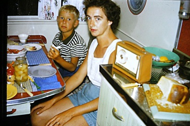 Valarie Latham and son Brian inside the family caravan 1962 [LHRN5437-33]