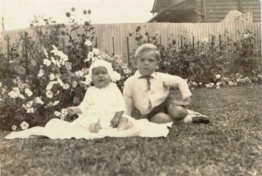Valarie Latham and her brother Kenneth Latham in the back yard of 4 Storey Rd, Reservoir, 1932 [LHRN5437-7]